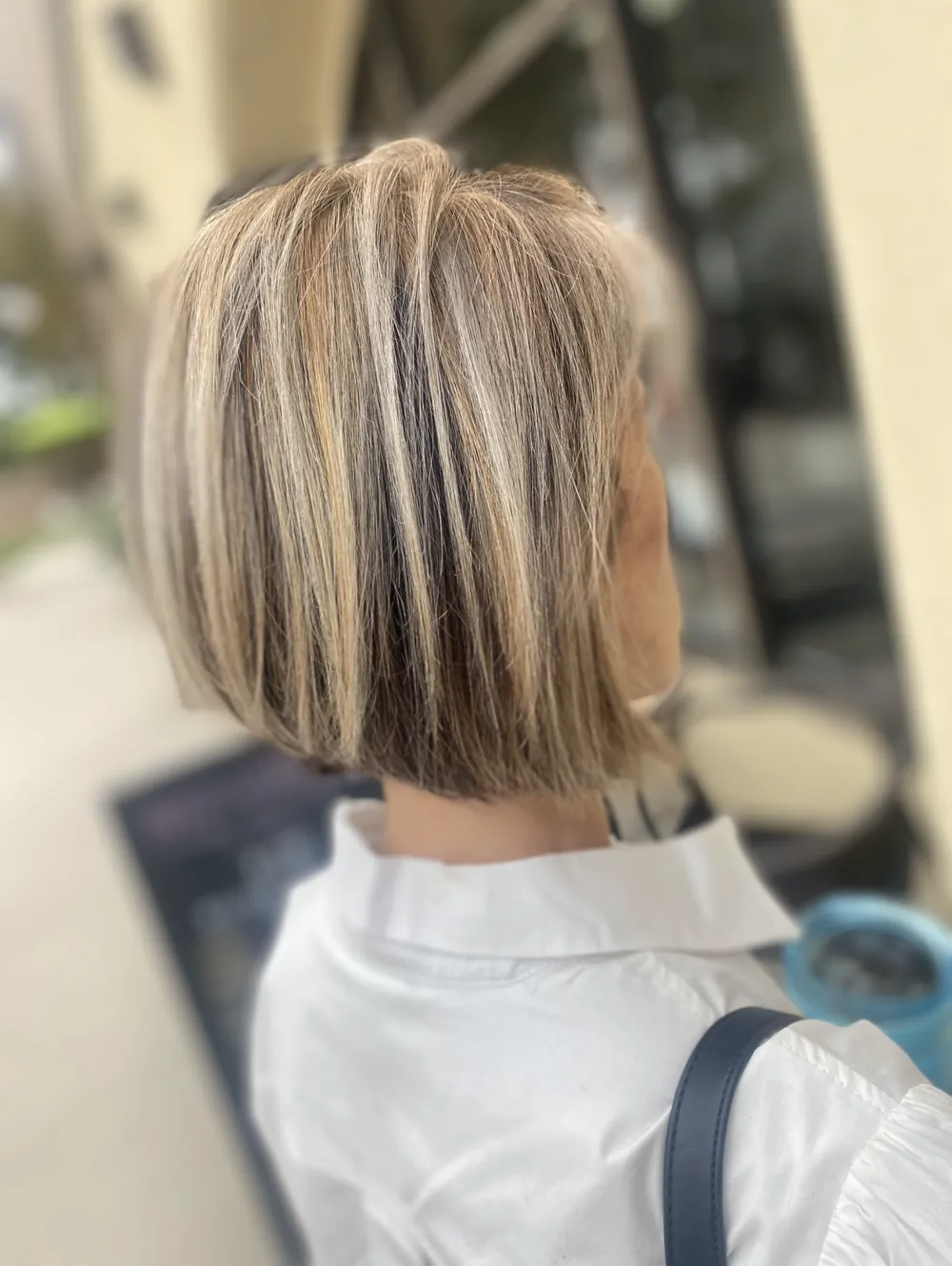 A chin-length bob with bright blonde highlights